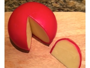 Edam cheese is case in wax to protect it from drying out and from spoilage. I think it is too bland, but my son likes it
